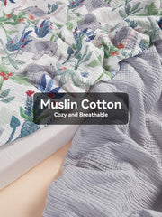 TILLYOU Grey muslin crib sheet offers soft, breathable cotton for baby comfort.