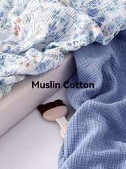 TILLYOU muslin crib sheet close-up, breathable cotton for baby comfort.