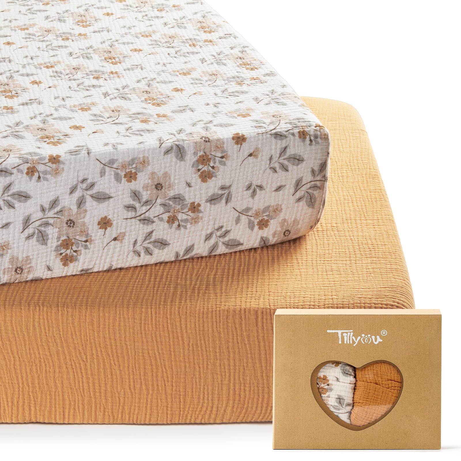TILLYOU muslin crib sheets in yellow flower folded, soft texture for baby's skin.
