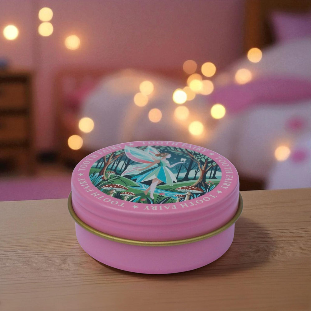 Bedtime moment captured with the TINIT Tooth Fairy Tin Box.