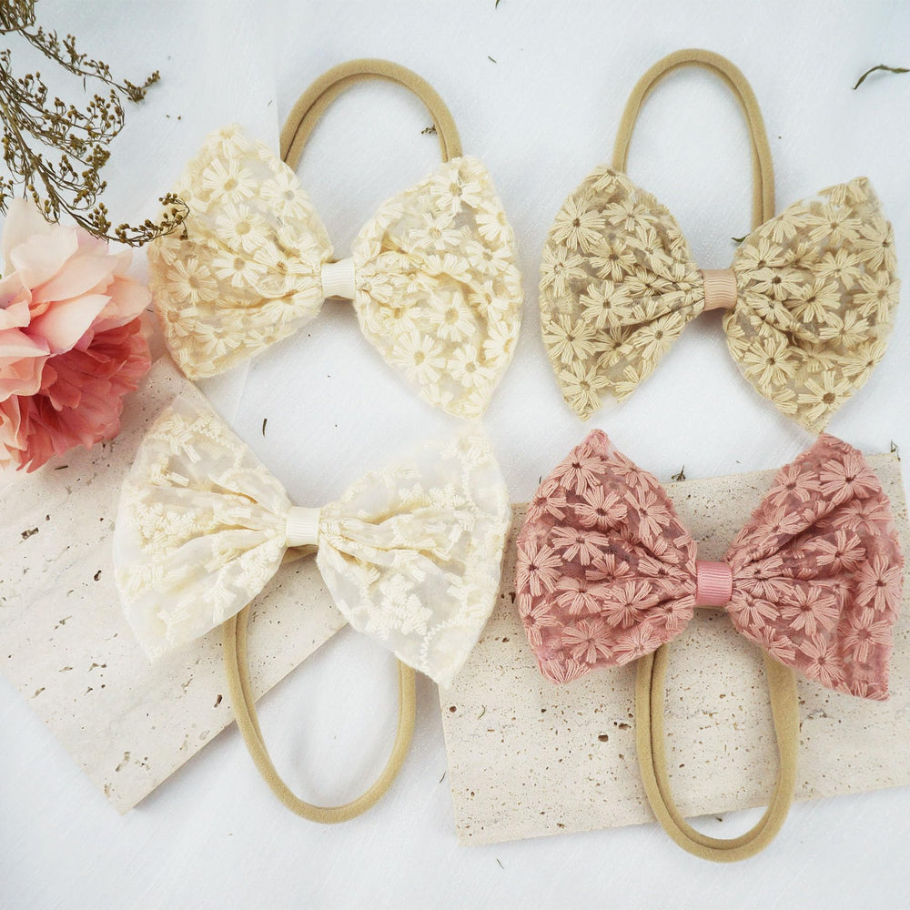 Tinsparkwin baby bow headband adjustable, one-size-fits-all comfort.