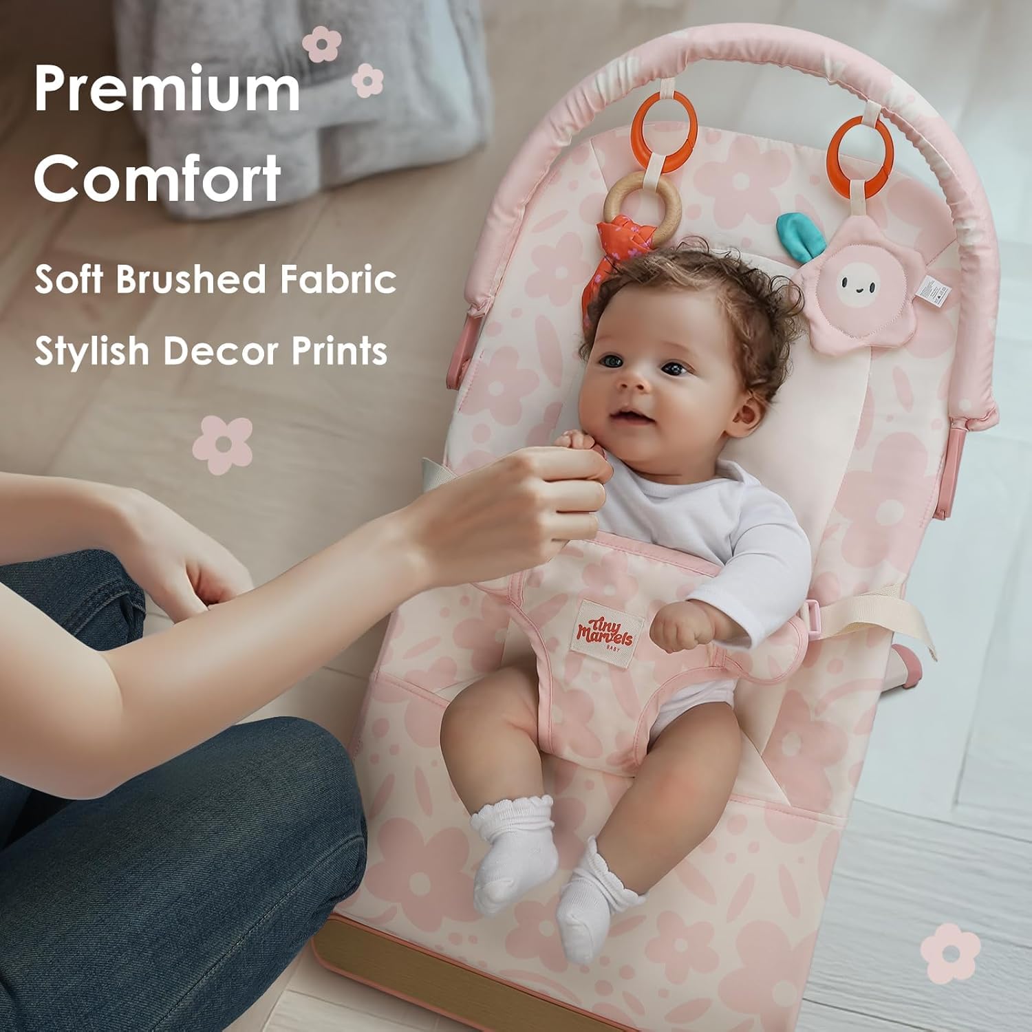Tiny Marvels pink floral bouncer includes plush mirror toy for visual engagement