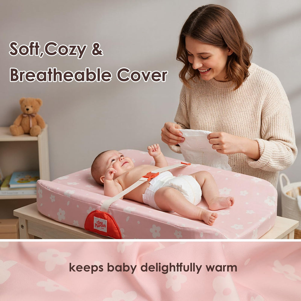 Tiny Marvels pad with quick-release belt keeping baby in place during changes