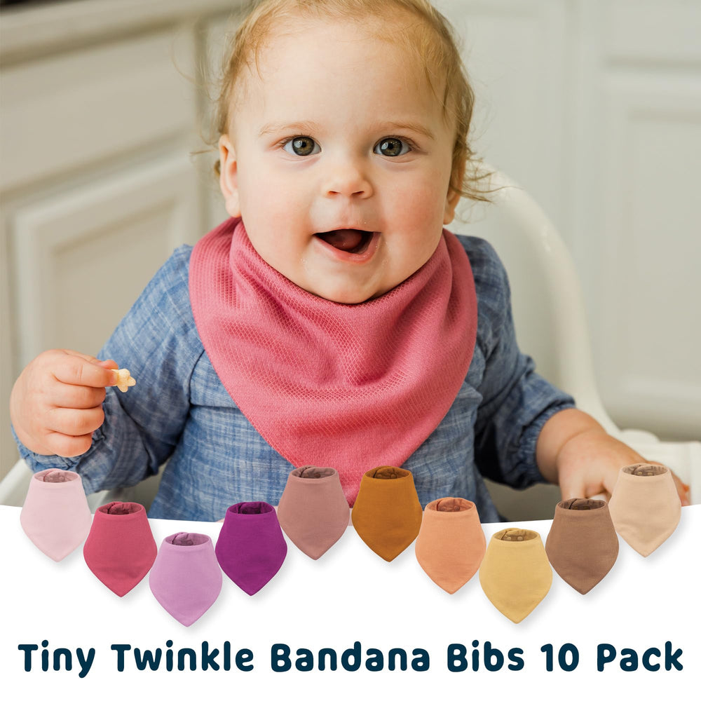 Folded Tiny Twinkle Bandana Bibs set ready for travel and daily use.