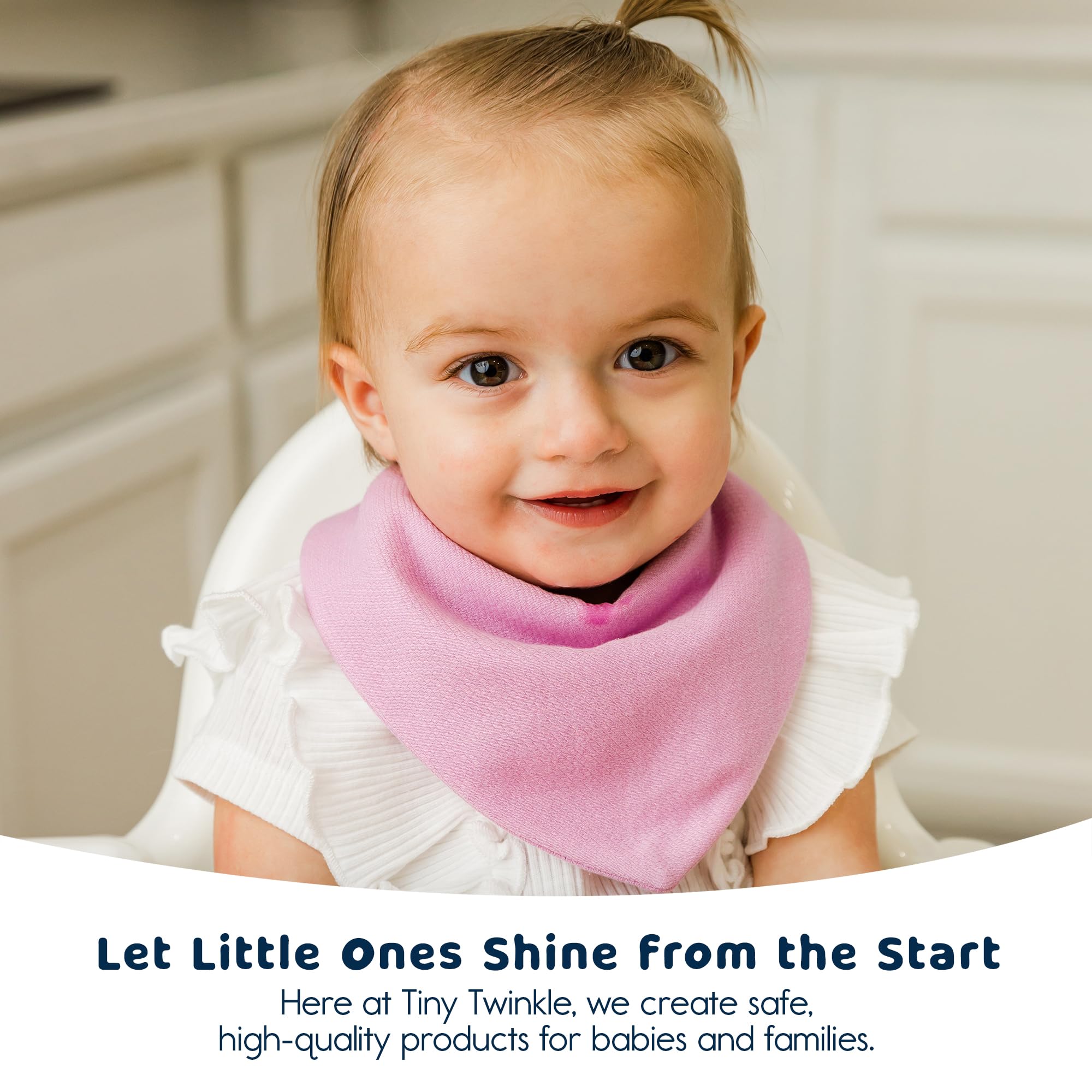 Baby wearing Tiny Twinkle bib during teething messes and meals.
