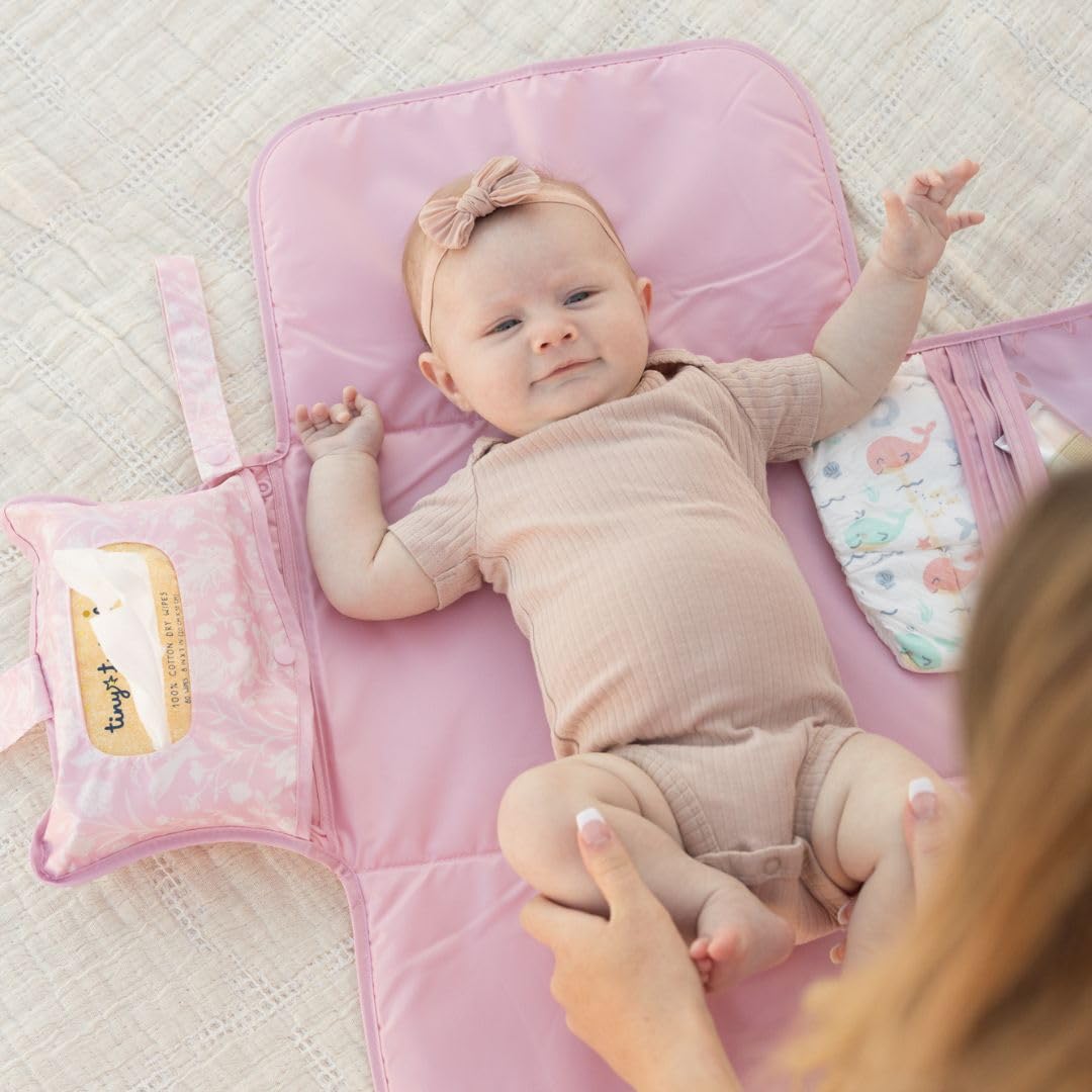 Tiny Twinkle changing pad keeps diapers and creams neatly organized during trips.