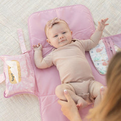 Tiny Twinkle changing pad keeps diapers and creams neatly organized during trips.