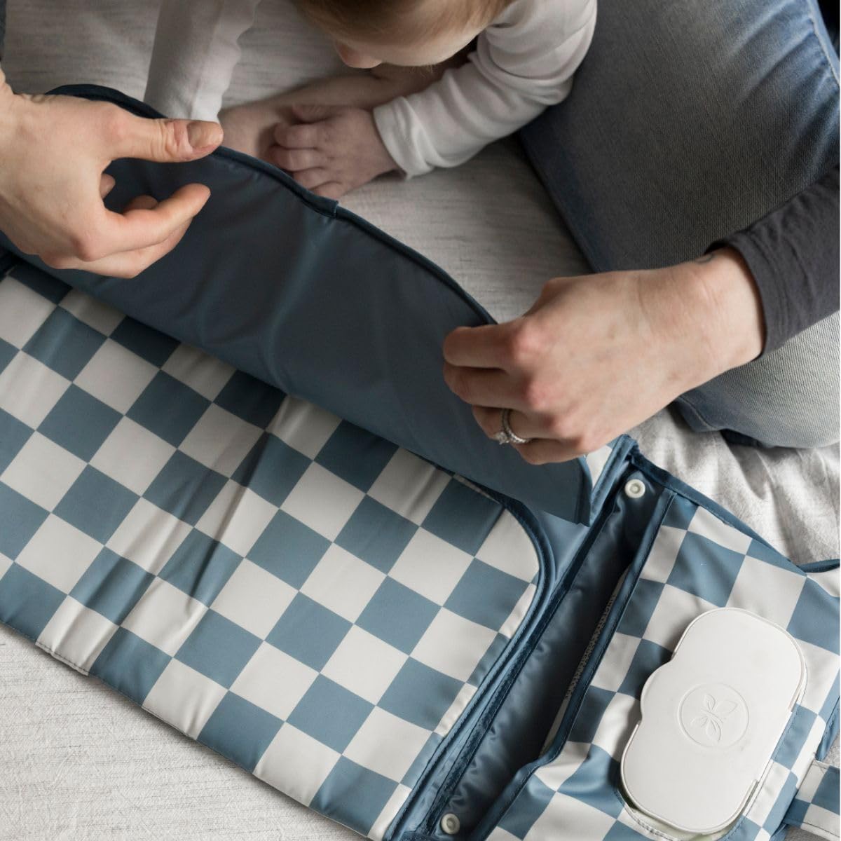 Tiny Twinkle changing pad serving as a travel changing station on the go.