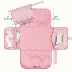 Tiny Twinkle changing pad with wipes pocket for fast one-handed access.