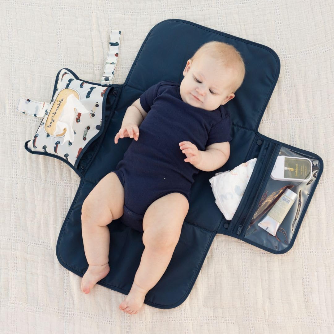 Tiny Twinkle pad with built-in wipes pocket for quick, one-handed access.