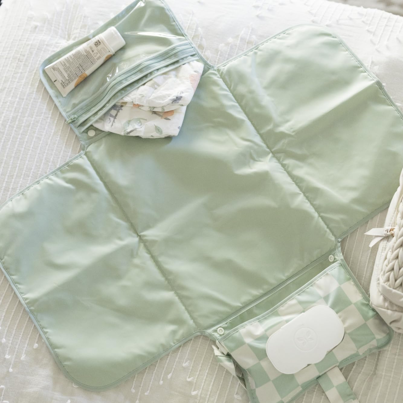 Tiny Twinkle pad clipped to a stroller for hands-free access