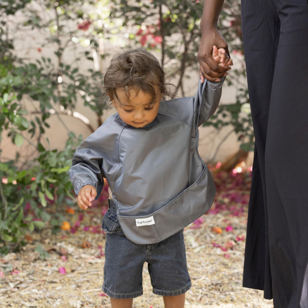 Elastic cuffs on Tiny Twinkle bib provide gentle, secure fit.