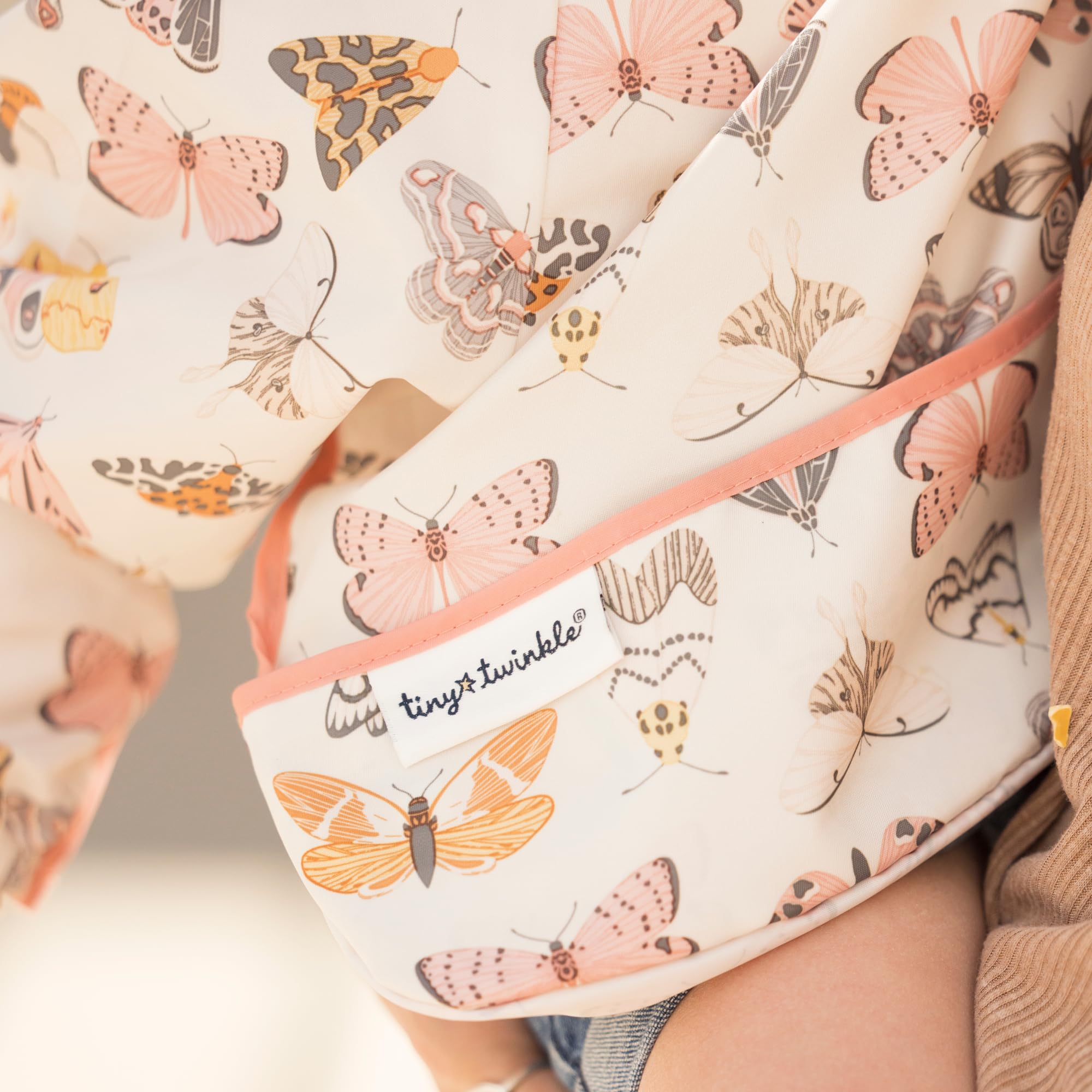 Tiny Twinkle elastic cuffs bib highlights flexible, comfy fit