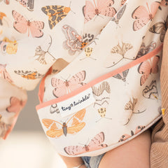 Tiny Twinkle elastic cuffs bib highlights flexible, comfy fit