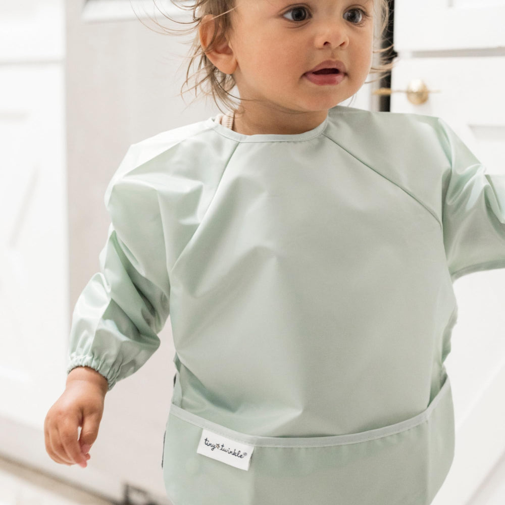 Full-coverage design from Tiny Twinkle long sleeve bib keeps mess contained.