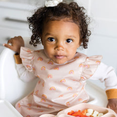 Tiny Twinkle machine-washable bib shown for quick cleanup after meals.