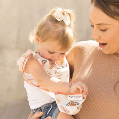 Tiny Twinkle machine washable bib for quick cleanup.