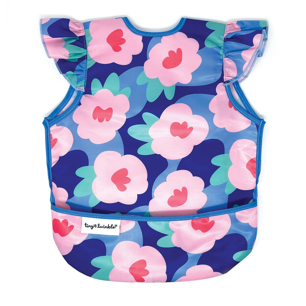 Tiny Twinkle mess-proof bib in floral blue close-up highlights soft fabric and spill resistance.