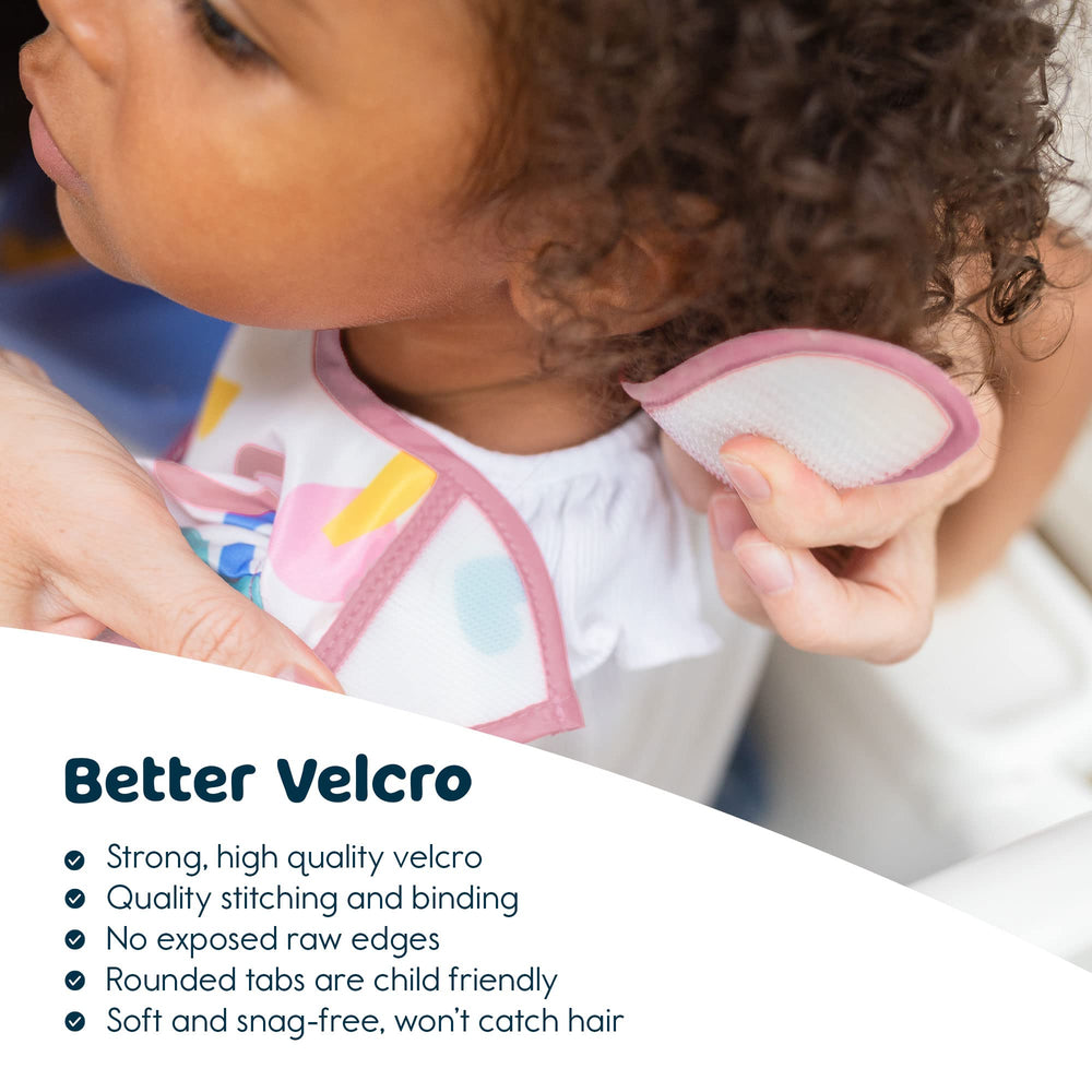 Tiny Twinkle Mess-Proof Bib is wipeable and quick to clean after meals.