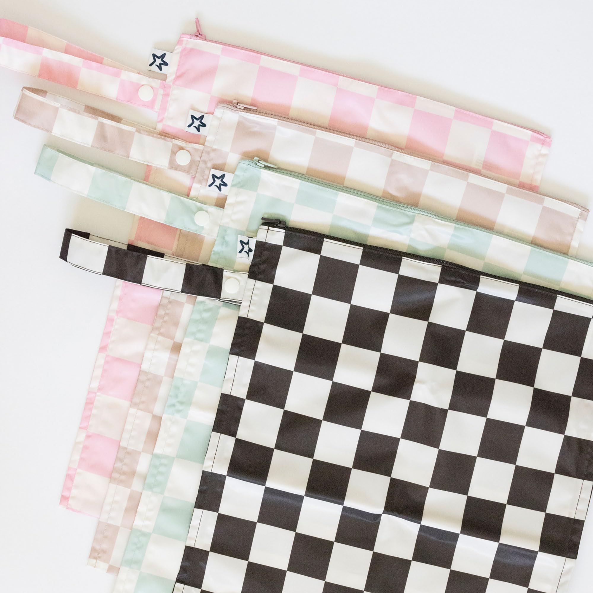 Baby clothes stored securely in Tiny Twinkle wet bag during daycare