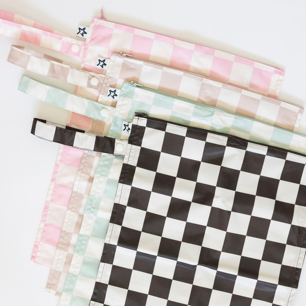 Baby clothes stored securely in Tiny Twinkle wet bag during daycare