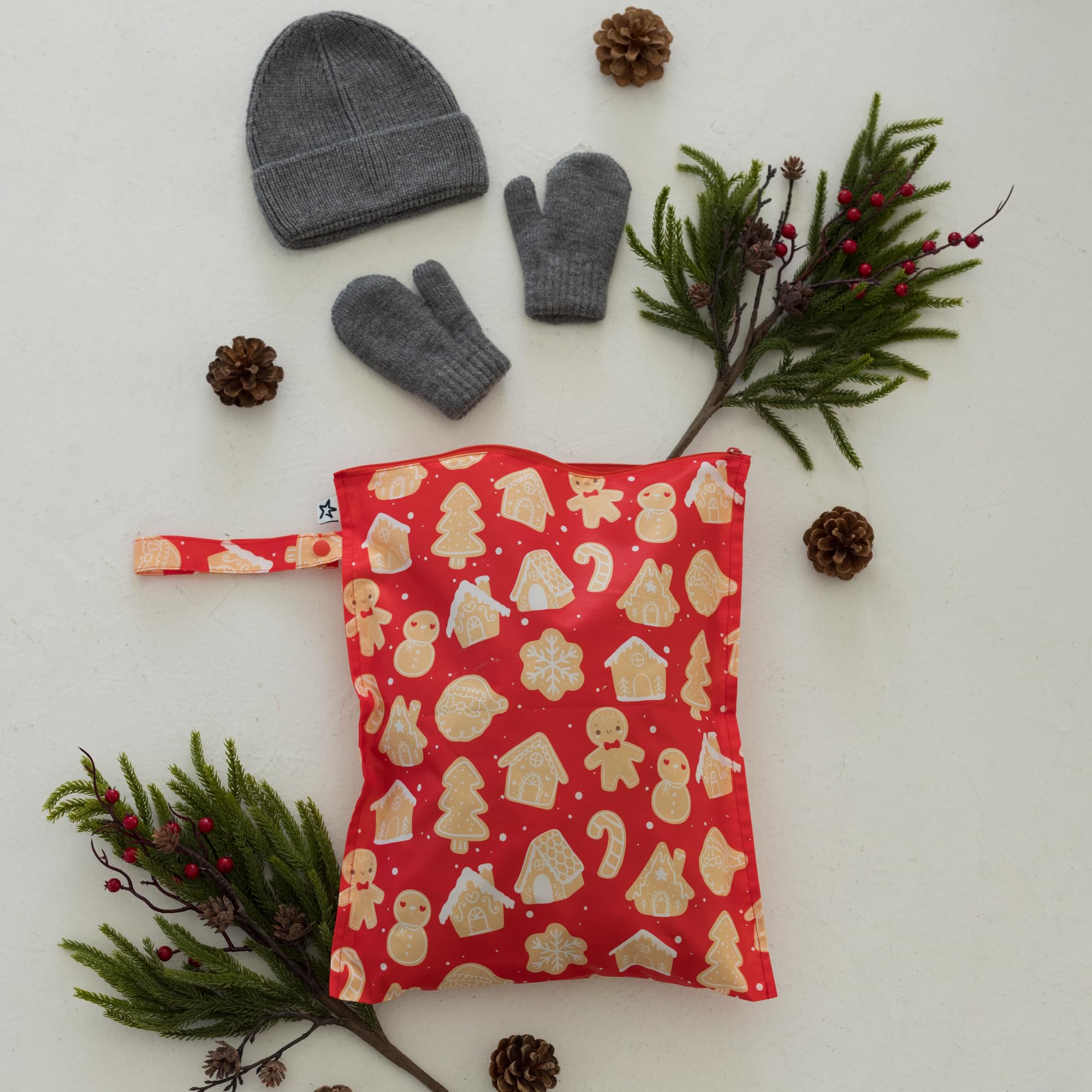 Tiny Twinkle Wet Bag attached to stroller strap for easy transport