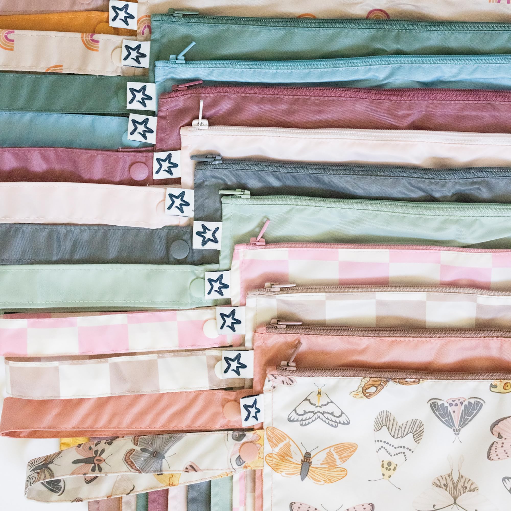Tiny Twinkle Mess-Proof Wet Bag stores swimsuits after pool or beach sessions.