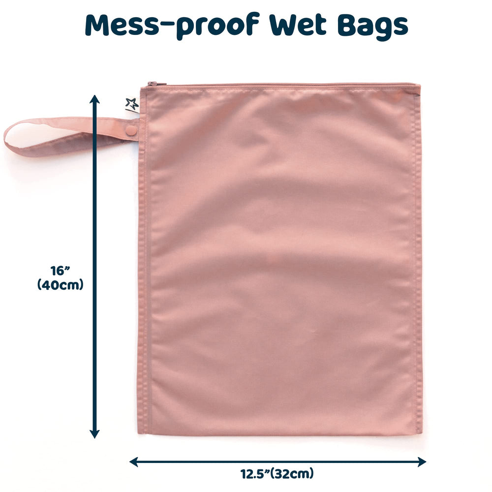 Tiny Twinkle Mess Proof Wet Bags inside a diaper bag ready to store cloth diapers.