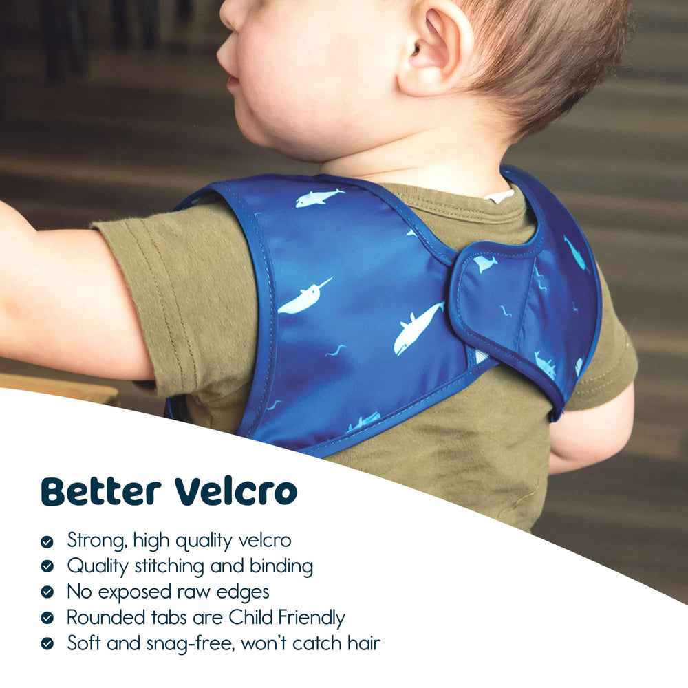Tiny Twinkle Ocean Life bib providing protection from spills at mealtime.