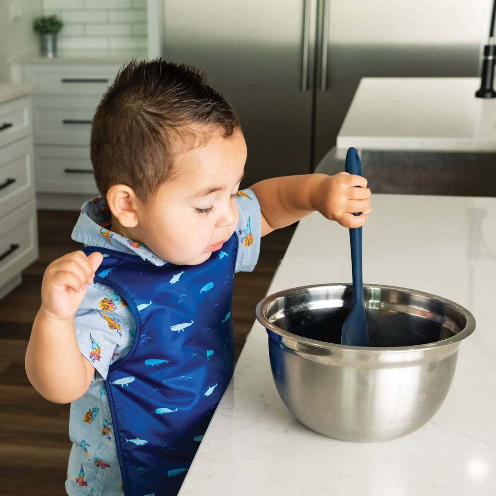 Tiny Twinkle Ocean Life bib worn by toddler during feeding with comfortable fit.