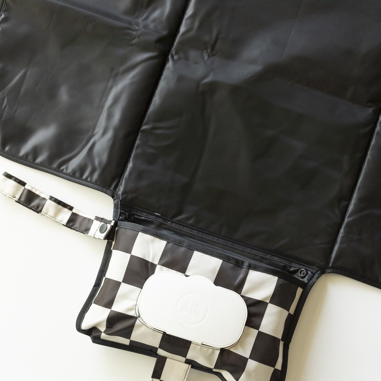 Tiny Twinkle organized storage pockets keeping diapers within reach.