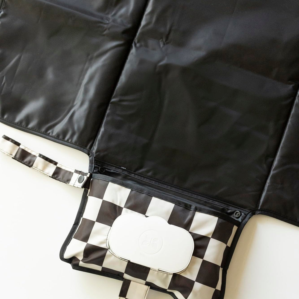 Tiny Twinkle organized storage pockets keeping diapers within reach.