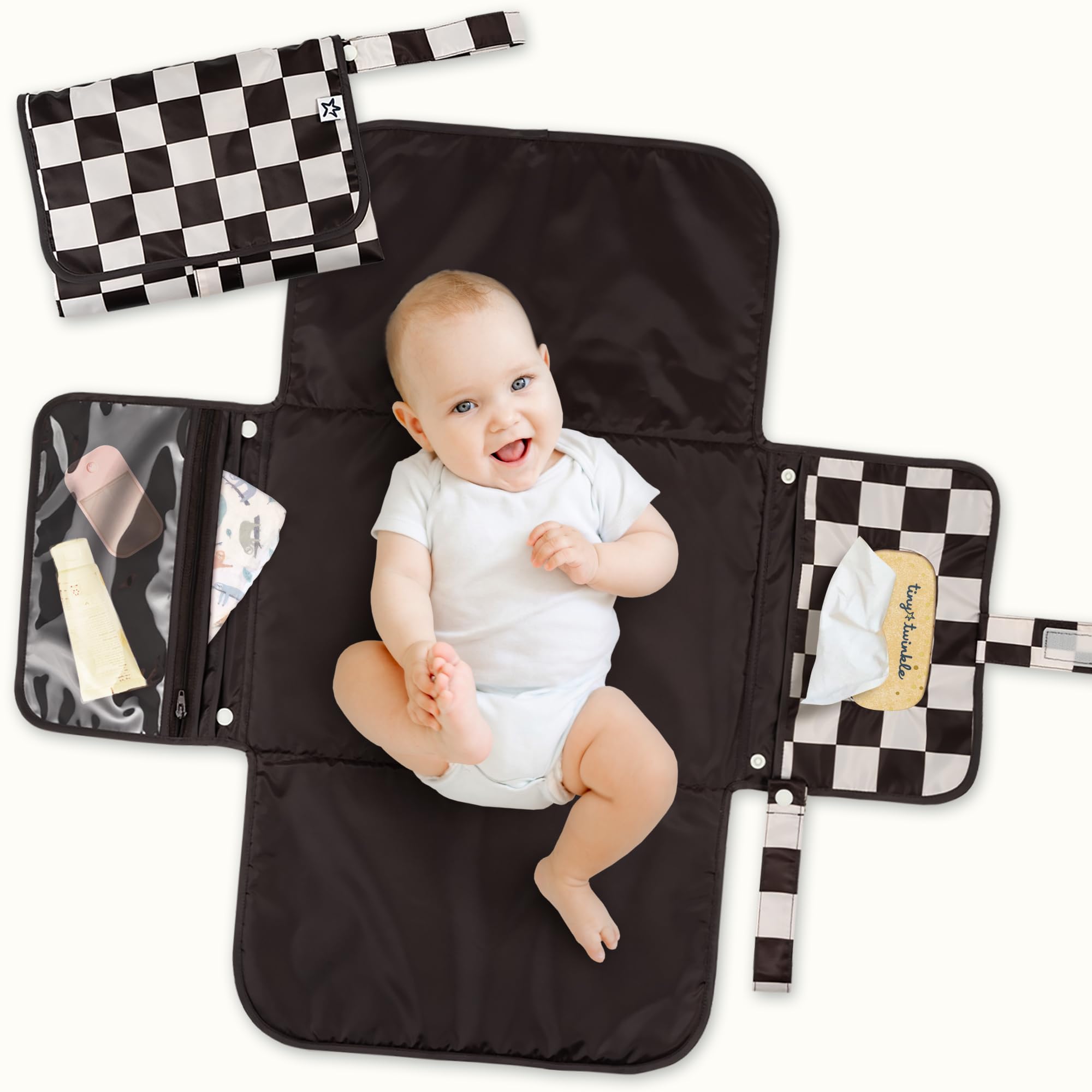 Tiny Twinkle portable changing pad with waterproof surface for travel.