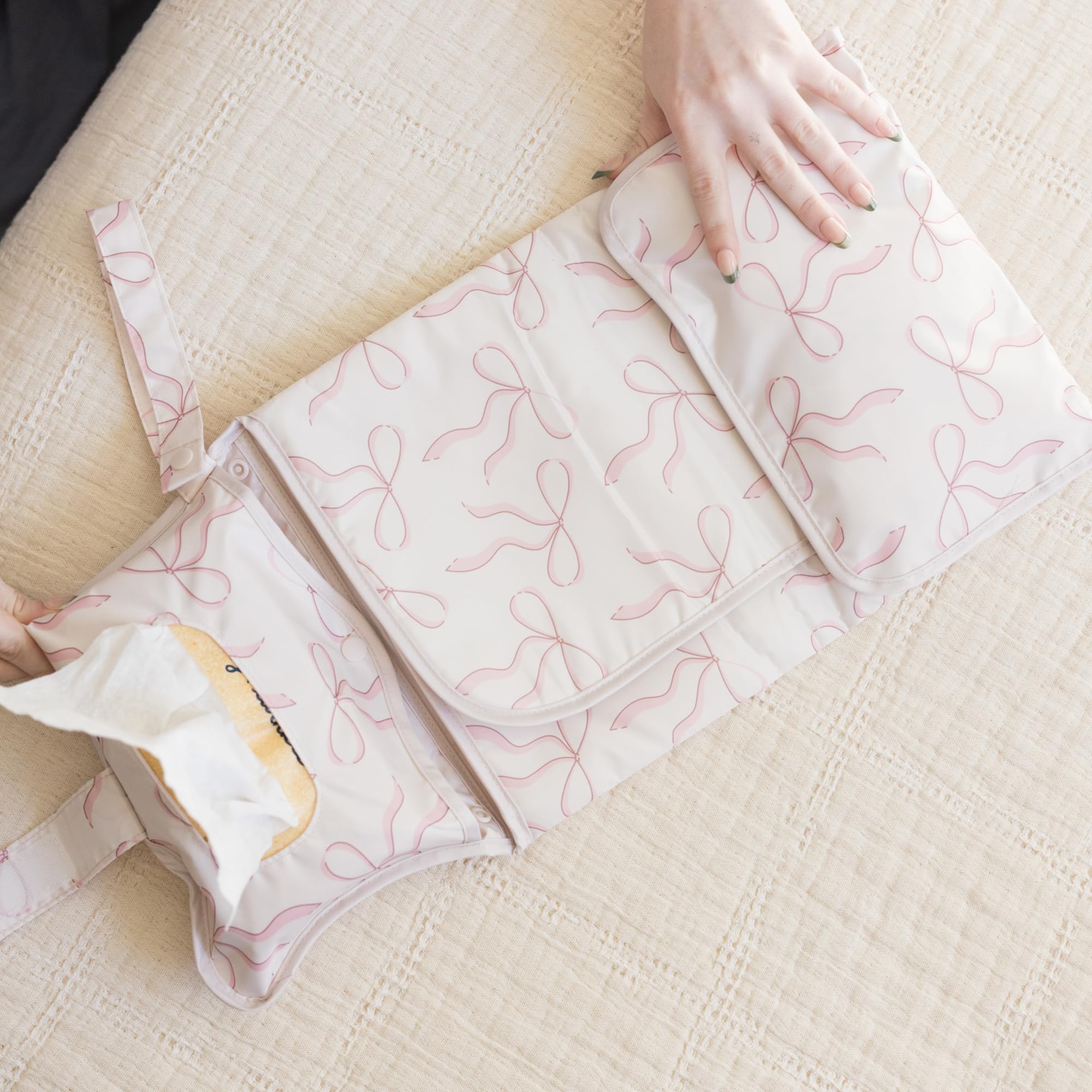 Tiny Twinkle diaper changing pad provides a waterproof surface for messy moments