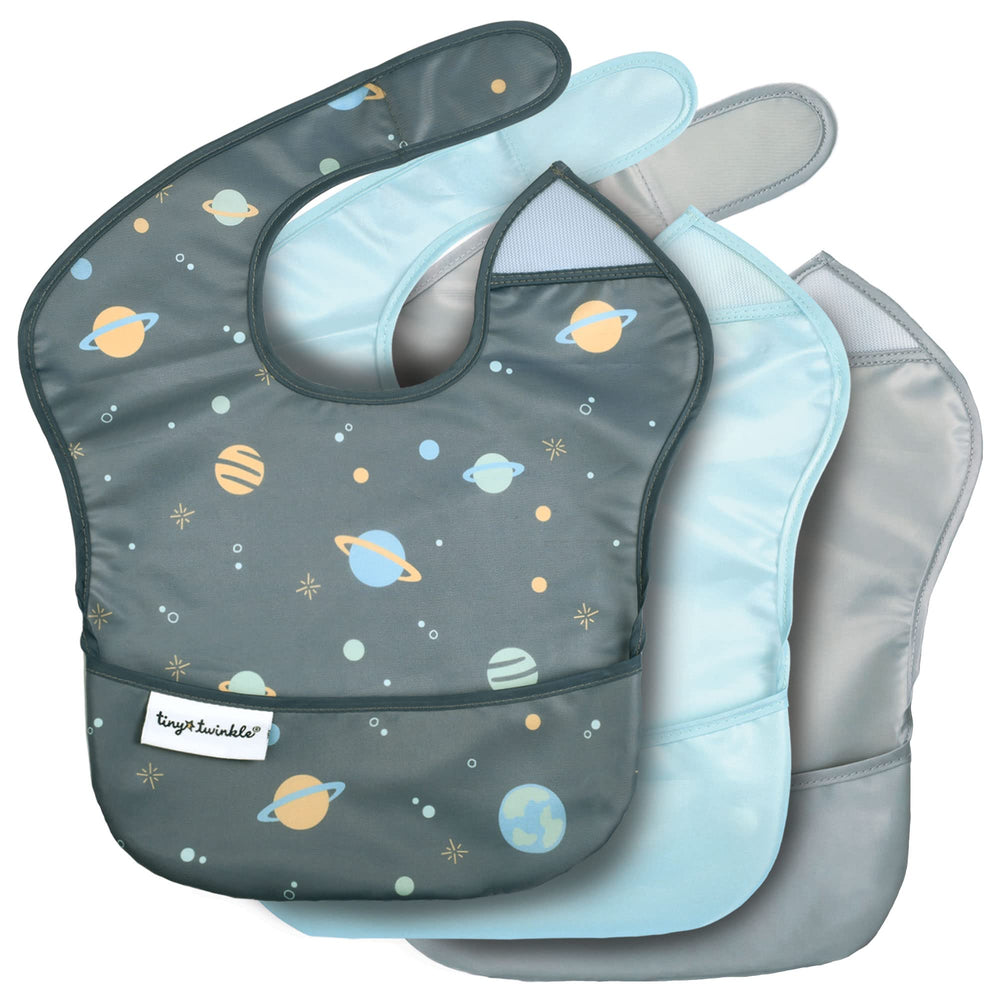 Tiny Twinkle space bib with catch pocket keeps messes contained during meals.
