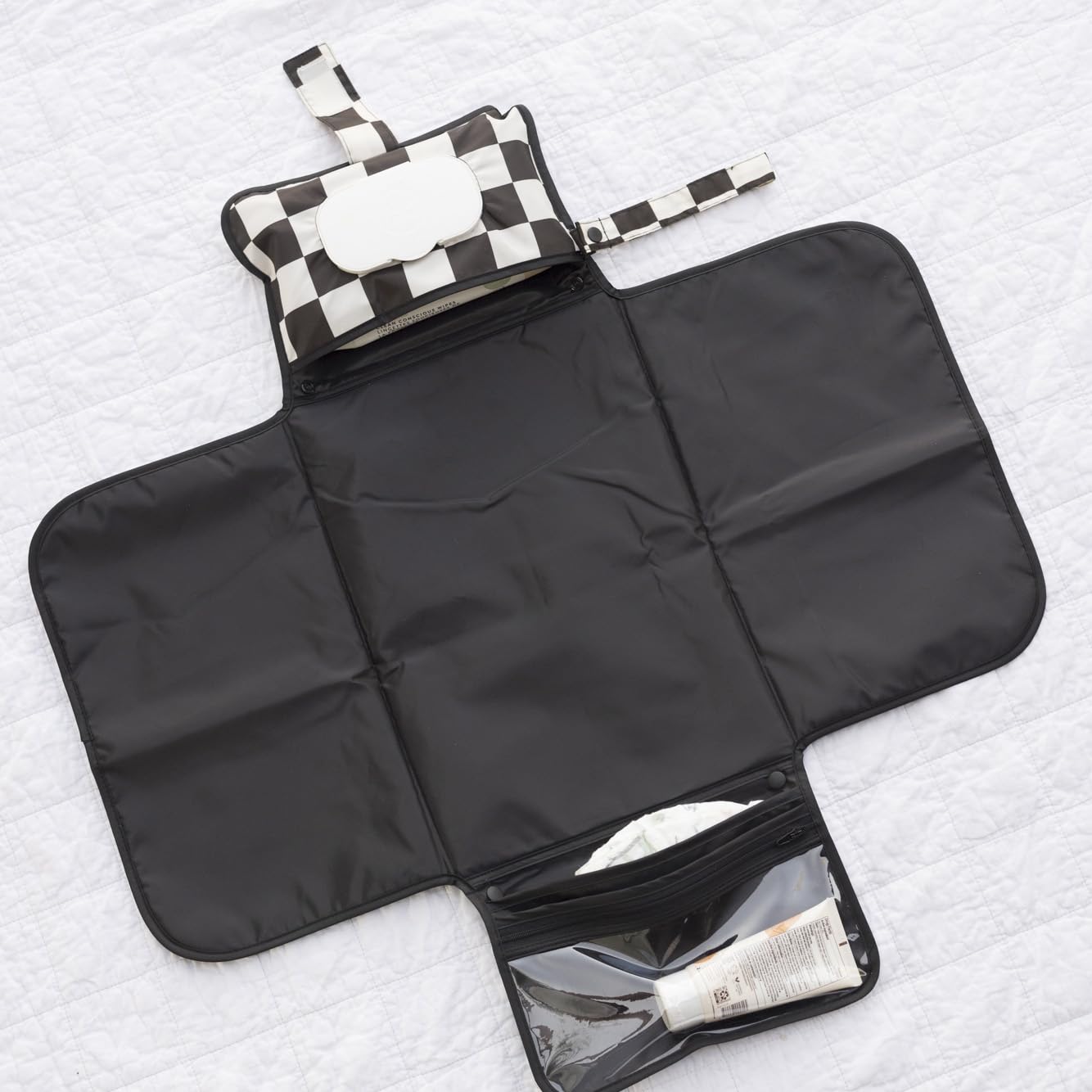 Tiny Twinkle stroller clip-loop keeps pad secure on the go.