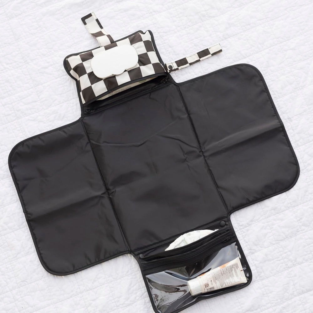 Tiny Twinkle stroller clip-loop keeps pad secure on the go.