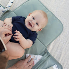 Tiny Twinkle stroller clip keeps the pad securely attached during outings.