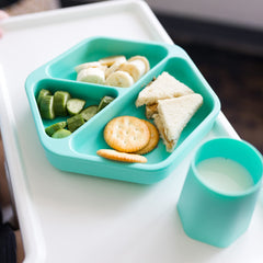 Tiny Twinkle suction base on tray demonstrates reliable hold during toddler mealtime.