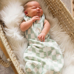 Swaddle-transition snaps on Tiny Twinkle sleep sack enable easy transition.