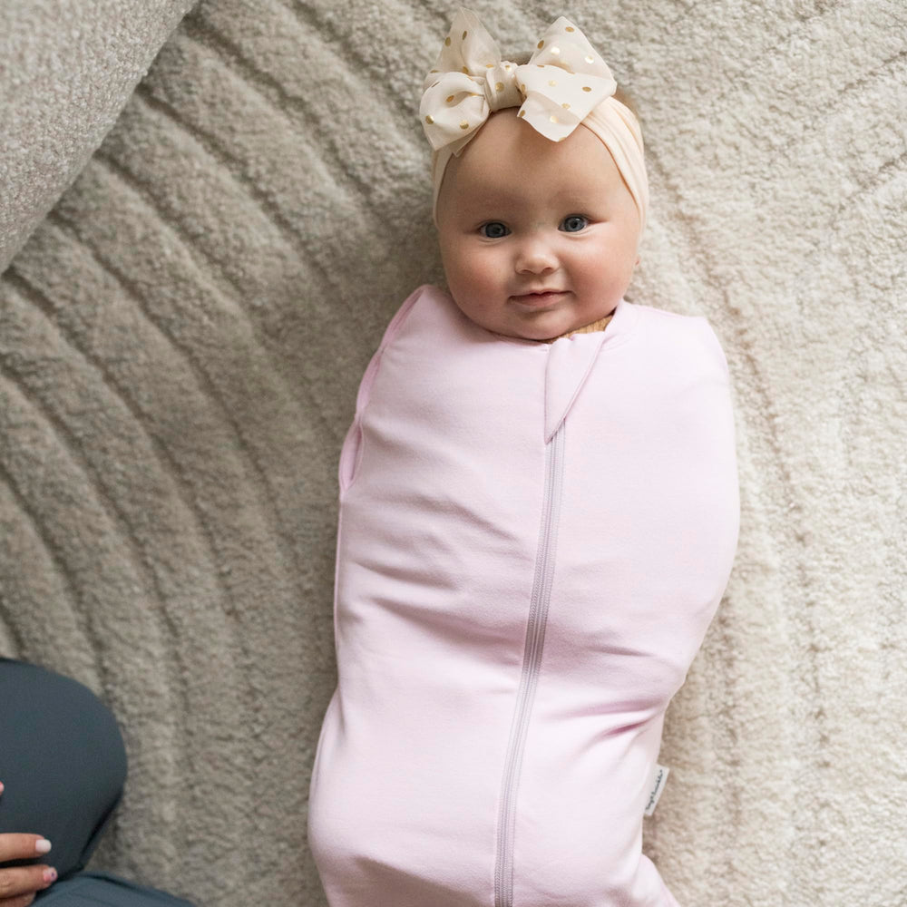 Tiny Twinkle swaddle transition demonstrates easy arms-in to arms-out adaptation