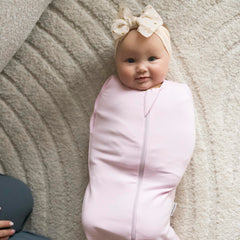 Tiny Twinkle swaddle transition demonstrates easy arms-in to arms-out adaptation