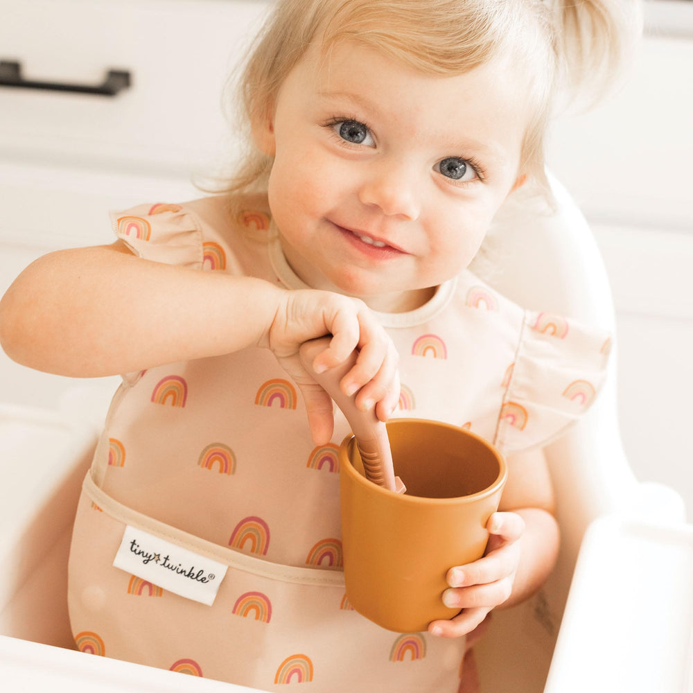 Tiny Twinkle waterproof bib fabric for quick spills and easy cleanup.