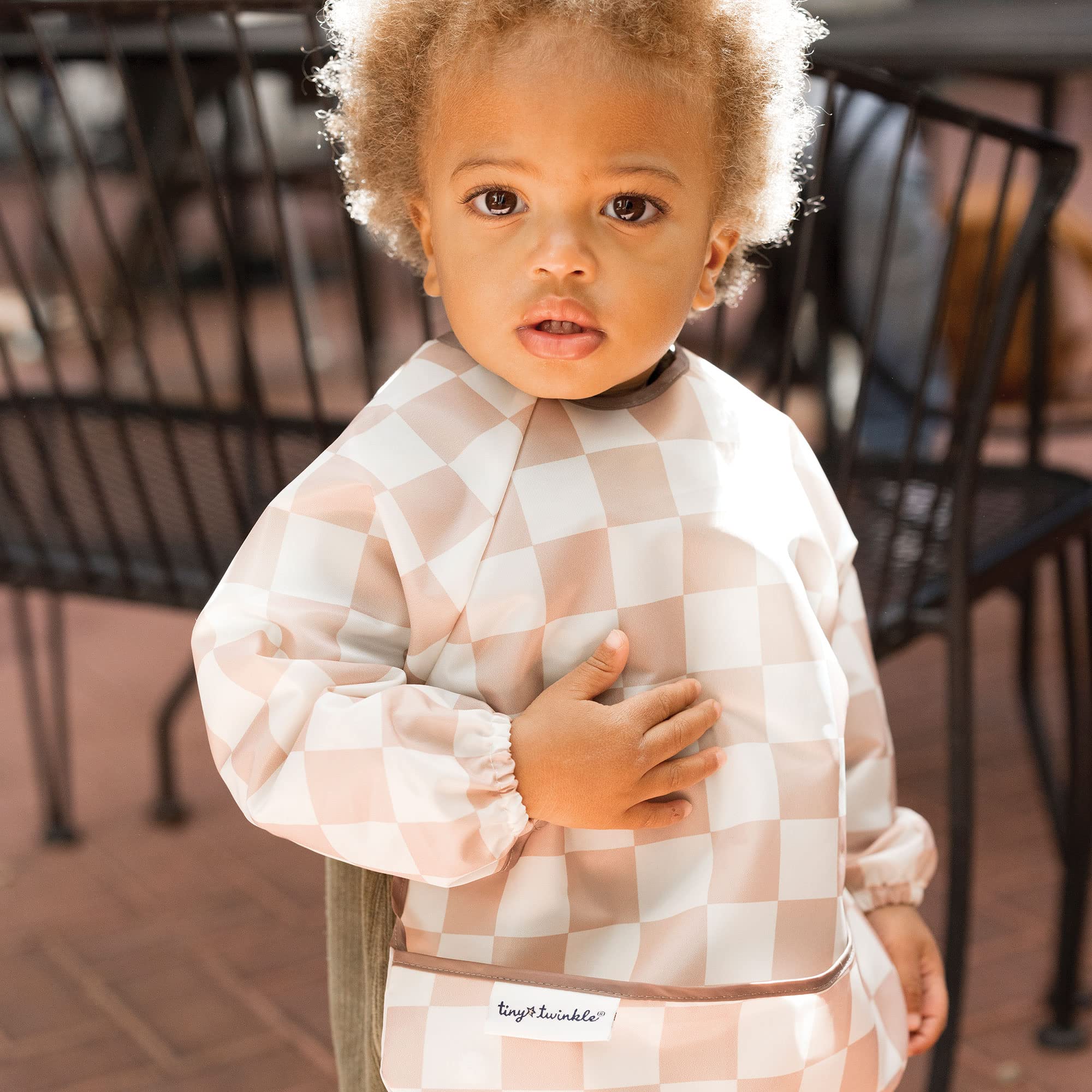 Tiny Twinkle waterproof smock bib demonstrates full-body coverage during meals.