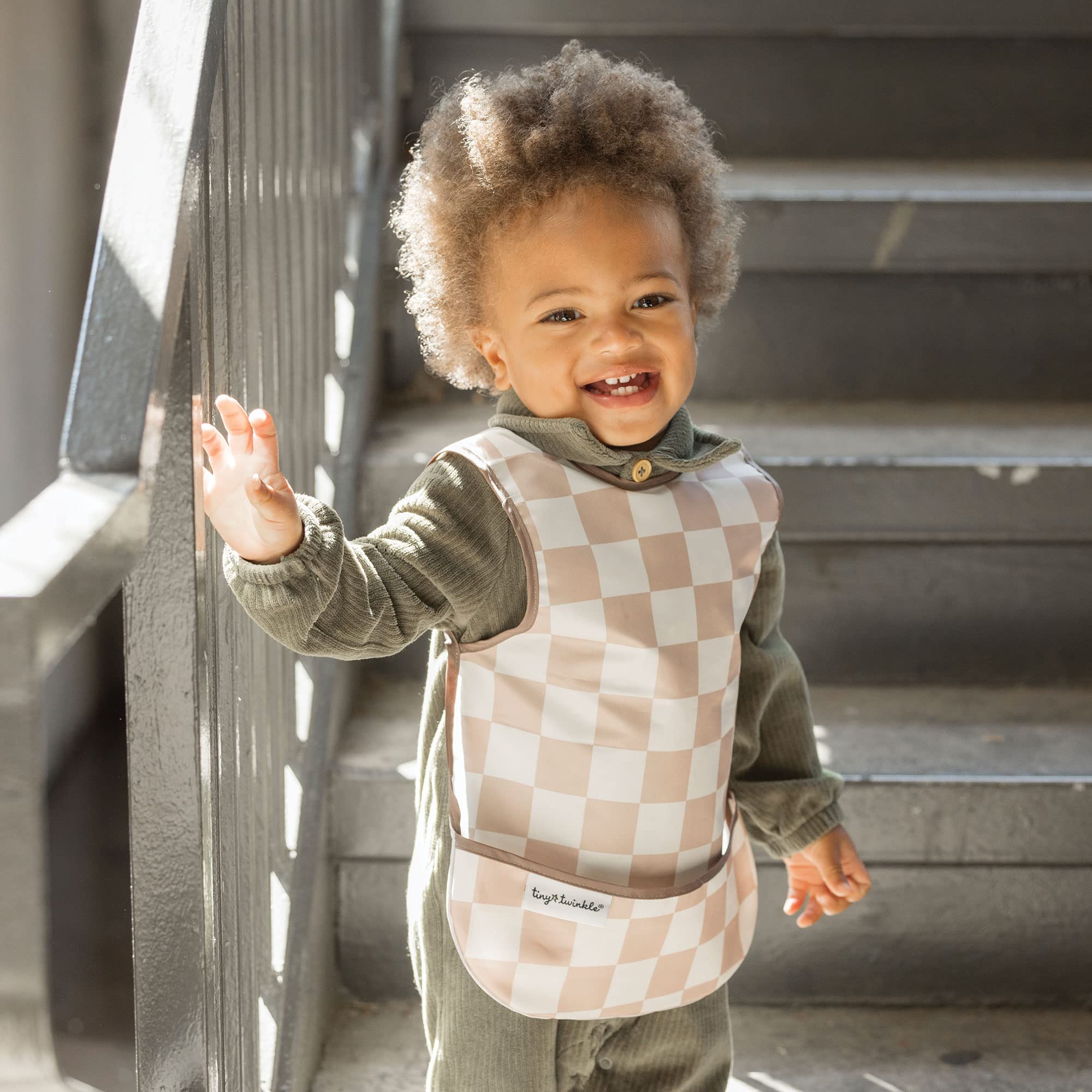 Tiny Twinkle waterproof toddler bib ideal for spills during feeding.