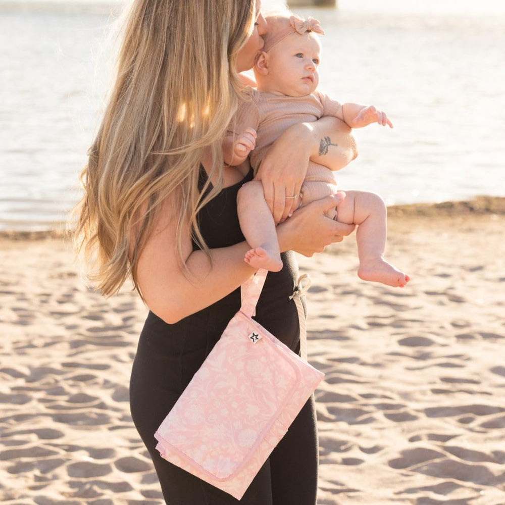 Tiny Twinkle waterproof wipeable surface protects against spills during diaper changes.