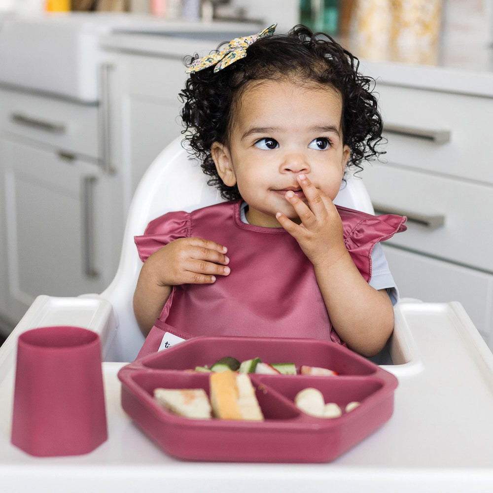 Tiny Twinkle wipeable bib dries quickly after mealtimes.
