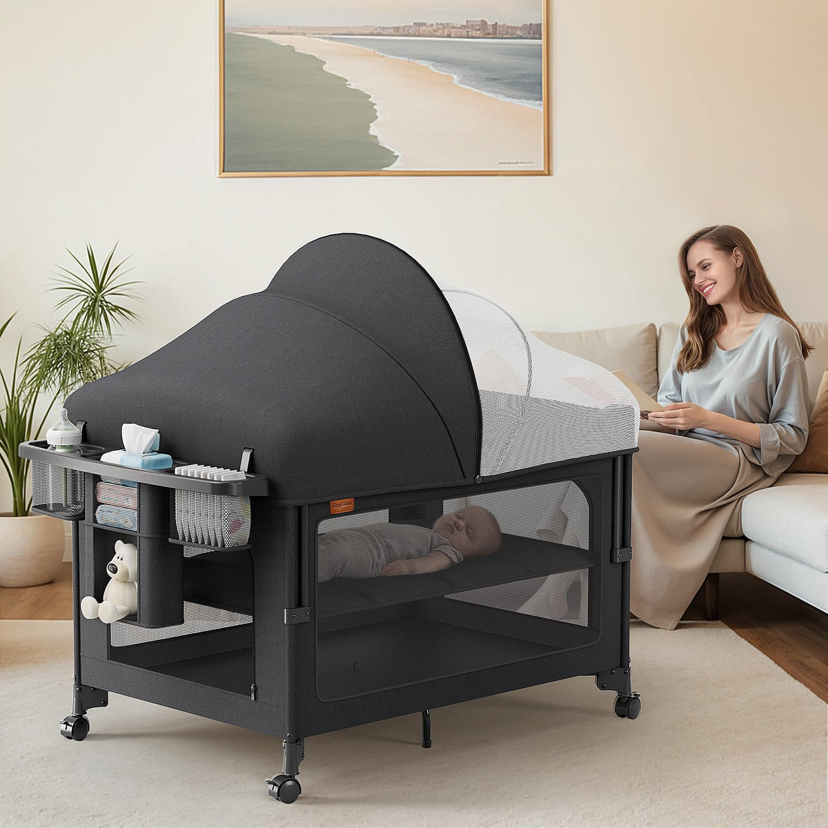 TinyGlow 4-in-1 baby bassinet pack and play setup showing versatile modes.