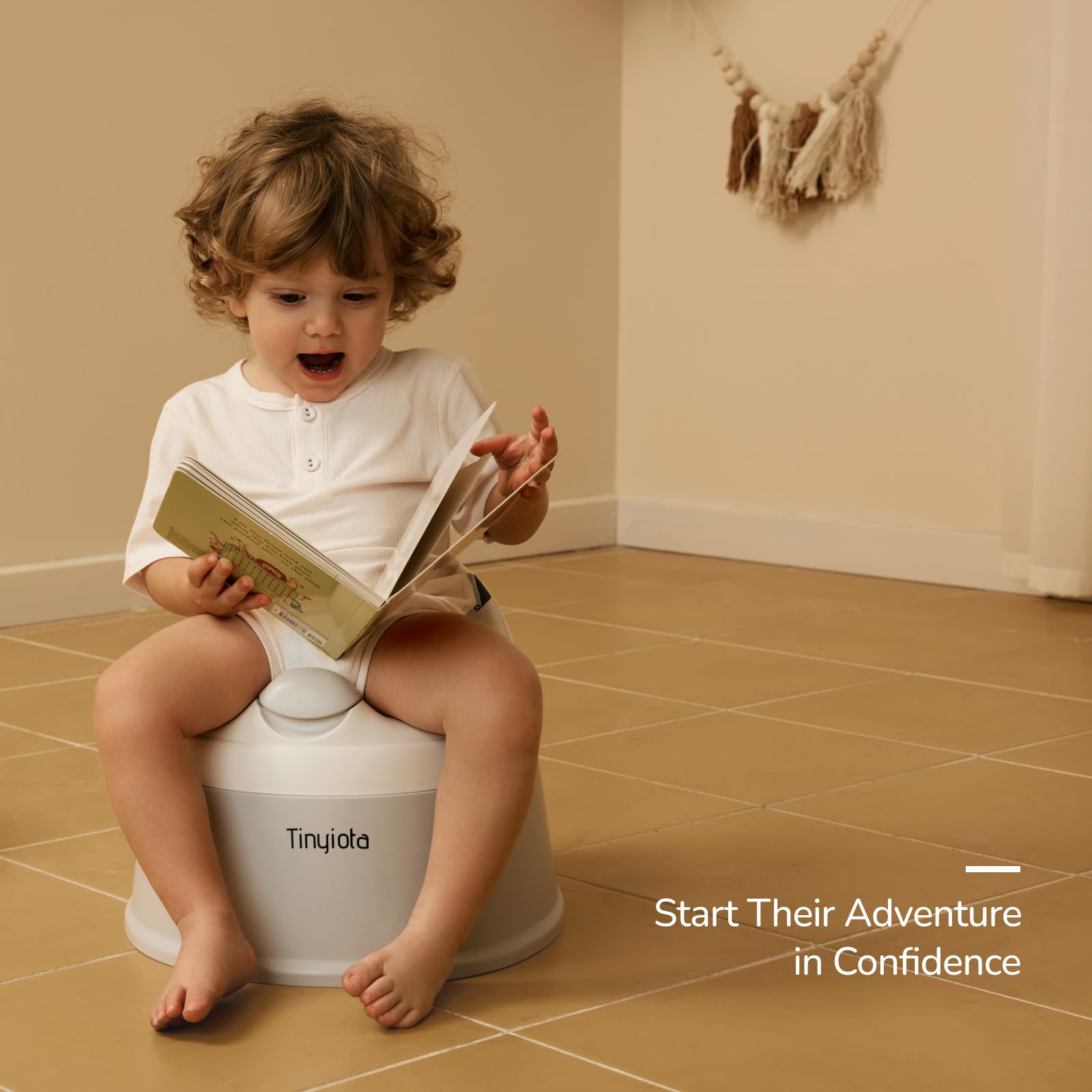 Tinyiota gray potty is lightweight and easy to clean.