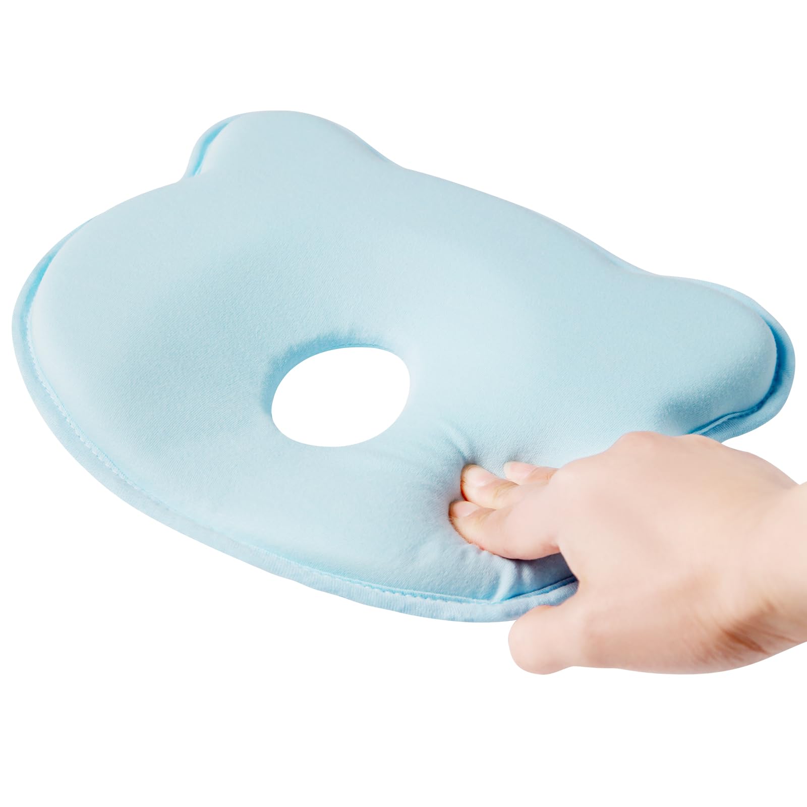 TinyTotsJoy dual-use pillow supports crib naps and tummy time.